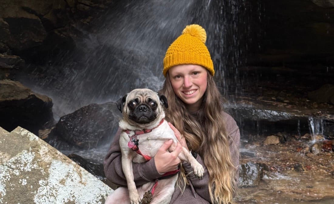 Mr. Chubbs held by his keeper at a waterfall